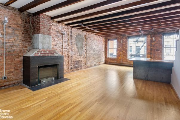 Empty room, Fireplace, Interior, Stone Walls, Wooden Beams, Wood Texture Flooring