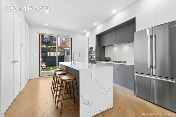 Interior, Kitchen, Marble Walls, Recessed Lighting, Stainless Steel Appliances, Wood Texture Flooring