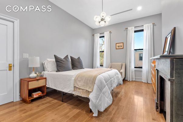 Bedroom, Fireplace, Interior, Pendant Lights, Recessed Lighting, Wood Texture Flooring