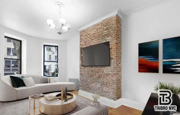 Chandelier, Fireplace, Interior, Living room, Stone Walls, Wood Texture Flooring