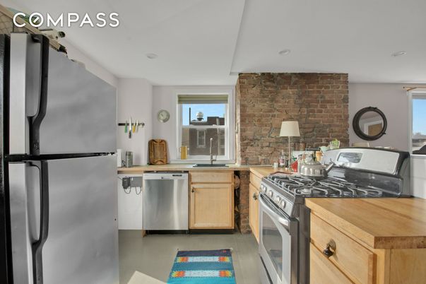 Interior, Kitchen, Recessed Lighting, Stainless Steel Appliances, Stone Walls