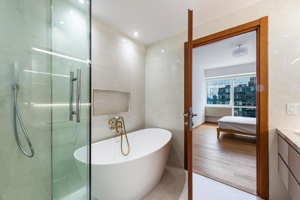 Bathroom, Free Standing Baths, Glass Shower, Interior, Recessed Lighting, Wood Texture Flooring