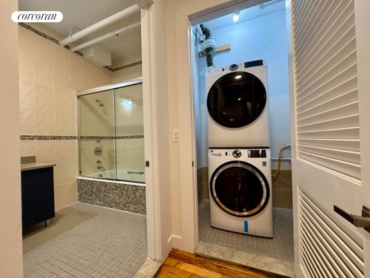 Bathroom, Glass Shower, Interior, Utility Closets, Washer, Wood Texture Flooring