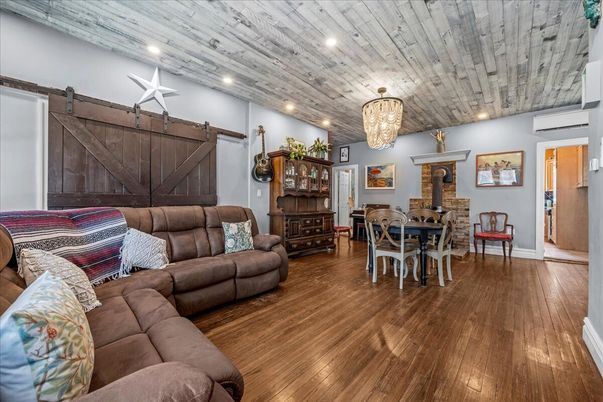 Chandelier, Dining room, Fireplace, Interior, Living room, Recessed Lighting, Wooden Ceilings, Wood Texture Flooring