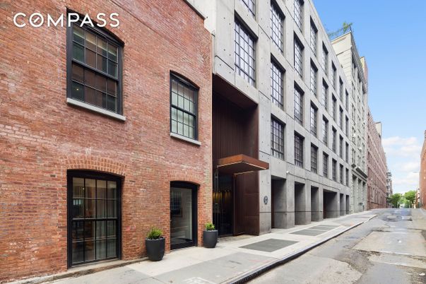Exterior, Facade, Brick Facade, Condo Building