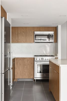 Interior, Kitchen, Marble Walls, Recessed Lighting, Stainless Steel Appliances