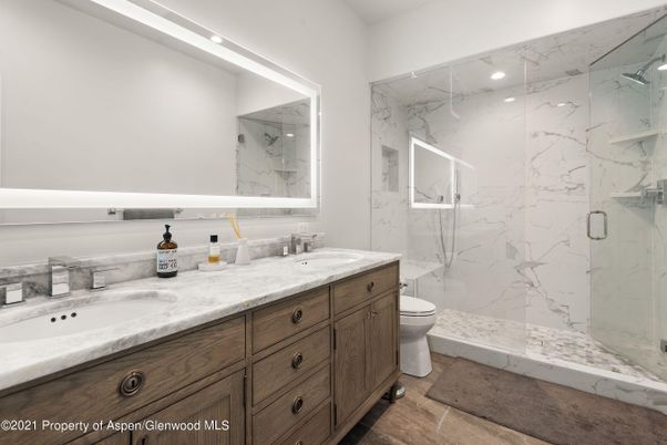Bathroom, Dual Sink Vanities, Glass Shower, Interior, Marble Walls, Recessed Lighting