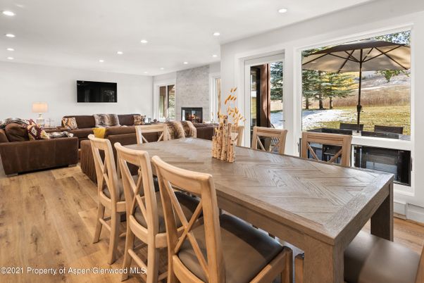 Dining room, Fireplace, Interior, Living room, Recessed Lighting, Wood Texture Flooring
