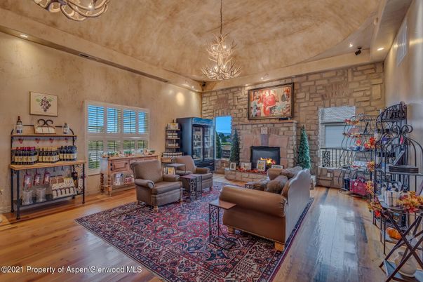 Chandelier, Fireplace, Interior, Living room, Pendant Lights, Recessed Lighting, Stone Walls, Wood Texture Flooring