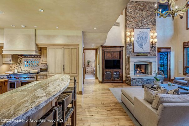 Fireplace, Interior, Kitchen, Living room, Recessed Lighting, Stone Walls, Wood Texture Flooring