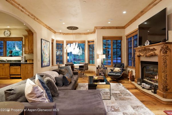 Chandelier, Dining room, Fireplace, Interior, Living room, Pendant Lights, Recessed Lighting, Wood Texture Flooring