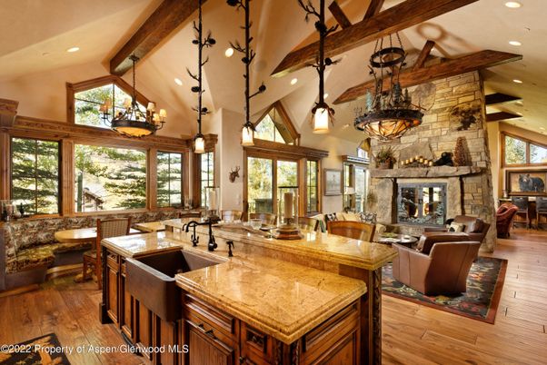 Chandelier, Dining room, Fireplace, Interior, Kitchen, Living room, Pendant Lights, Recessed Lighting, Stone Walls, Wooden Beams, Wood Texture Flooring