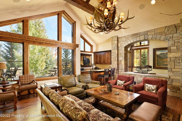 Chandelier, Interior, Living room, Recessed Lighting, Stone Walls, Wood Texture Flooring