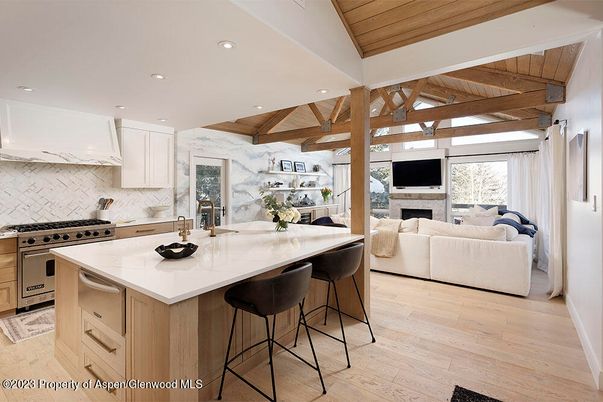 Fireplace, Interior, Kitchen, Living room, Marble Walls, Recessed Lighting, Stainless Steel Appliances, Wooden Beams, Wooden Ceilings, Wood Texture Flooring