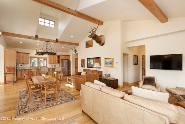 Dining room, Interior, Kitchen, Living room, Pendant Lights, Recessed Lighting, Stainless Steel Appliances, Wooden Beams, Wood Texture Flooring