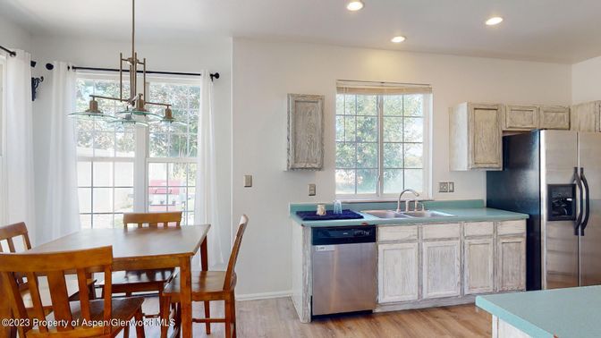 Dining room, Interior, Kitchen, Pendant Lights, Recessed Lighting, Stainless Steel Appliances, Wood Texture Flooring