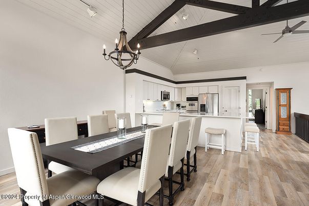 Chandelier, Dining room, Interior, Kitchen, Pendant Lights, Stainless Steel Appliances, Wooden Beams, Wood Texture Flooring