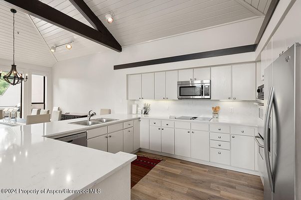 Chandelier, Dining room, Interior, Kitchen, Pendant Lights, Stainless Steel Appliances, Wooden Beams, Wood Texture Flooring