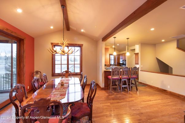 Chandelier, Dining room, Interior, Kitchen, Pendant Lights, Recessed Lighting, Wooden Beams, Wood Texture Flooring