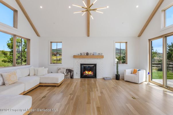 Fireplace, Interior, Living room, Pendant Lights, Recessed Lighting, Wooden Beams, Wood Texture Flooring