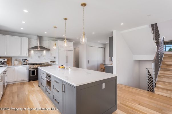 Interior, Kitchen, Pendant Lights, Recessed Lighting, Stainless Steel Appliances, Wood Texture Flooring