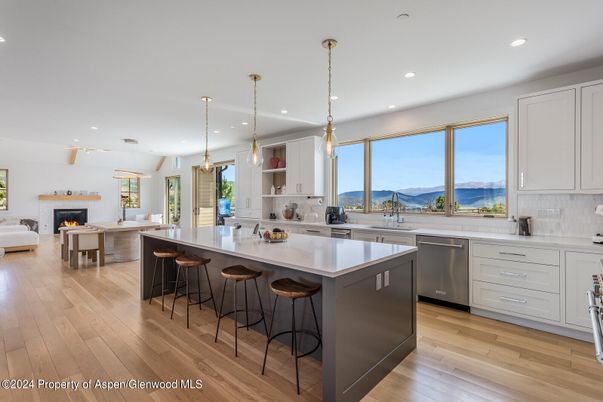 Dining room, Fireplace, Interior, Kitchen, Living room, Pendant Lights, Recessed Lighting, Stainless Steel Appliances, Wood Texture Flooring