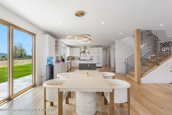 Dining room, Interior, Kitchen, Pendant Lights, Recessed Lighting, Stainless Steel Appliances, Wood Texture Flooring