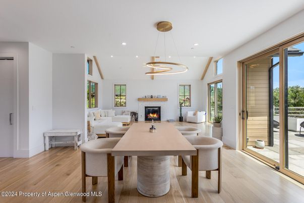 Dining room, Fireplace, Interior, Living room, Pendant Lights, Recessed Lighting, Wood Texture Flooring