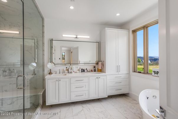 Bathroom, Dual Sink Vanities, Free Standing Baths, Glass Shower, Interior, Marble, Marble Walls, Recessed Lighting