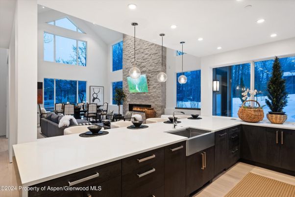 Dining room, Fireplace, Interior, Kitchen, Living room, Pendant Lights, Recessed Lighting, Stone Walls, Wood Texture Flooring
