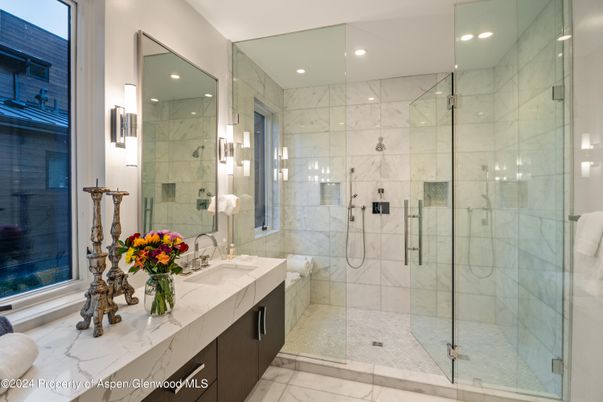 Bathroom, Dual Sink Vanities, Glass Shower, Interior, Marble, Marble Walls, Recessed Lighting