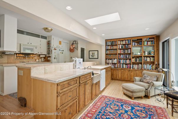 Interior, Kitchen, Recessed Lighting, Tile Countertops, Wood Texture Flooring
