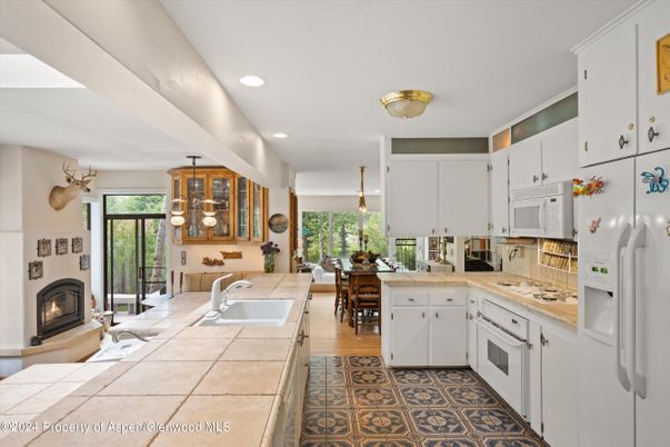 Dining room, Fireplace, Interior, Kitchen, Pendant Lights, Recessed Lighting, Wood Texture Flooring