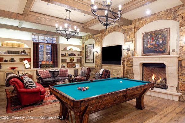 Billiard Table, Chandelier, Fireplace, Game Room, Interior, Living room, Recessed Lighting, Stone Walls, Wooden Beams, Wood Texture Flooring