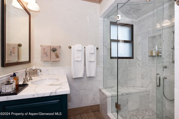 Bathroom, Glass Shower, Interior, Marble Walls, Wood Texture Flooring