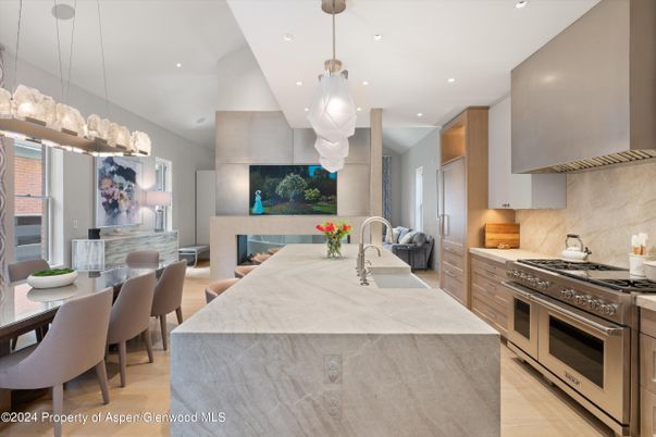 Dining room, Fireplace, Interior, Kitchen, Pendant Lights, Recessed Lighting, Stainless Steel Appliances, Wood Texture Flooring