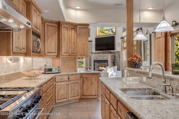 Fireplace, Interior, Kitchen, Pendant Lights, Recessed Lighting, Stainless Steel Appliances
