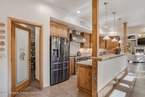 Fireplace, Interior, Kitchen, Pendant Lights, Recessed Lighting, Stainless Steel Appliances