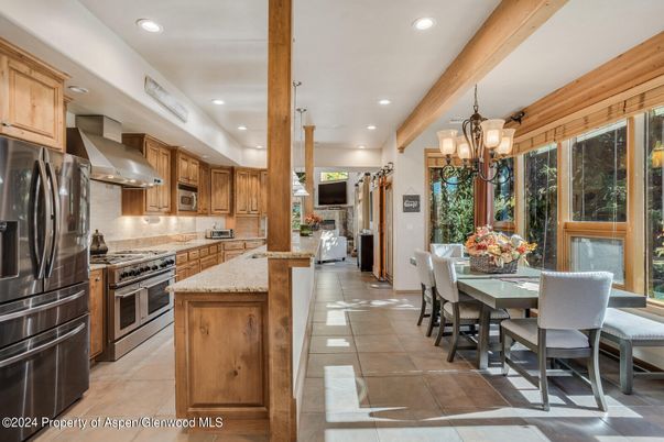 Chandelier, Dining room, Interior, Kitchen, Pendant Lights, Recessed Lighting, Stainless Steel Appliances, Wooden Beams