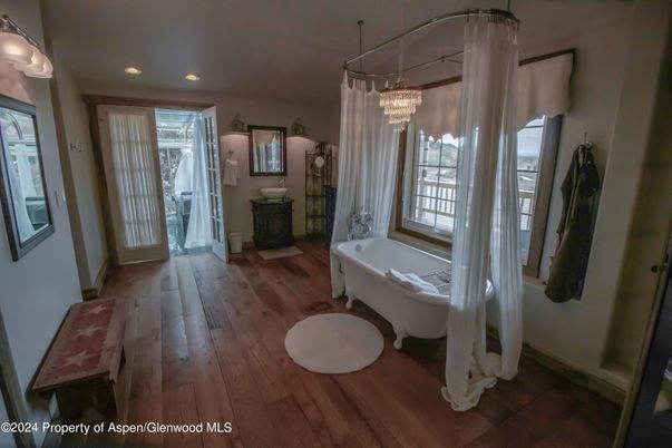 Bathroom, Chandelier, Free Standing Baths, Interior, Recessed Lighting, Wood Texture Flooring