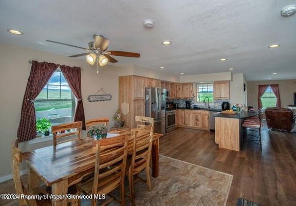 Dining room, Interior, Kitchen, Recessed Lighting, Stainless Steel Appliances, Wood Texture Flooring