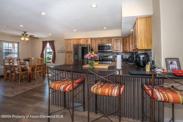 Dining room, Interior, Kitchen, Recessed Lighting, Stainless Steel Appliances, Wood Texture Flooring