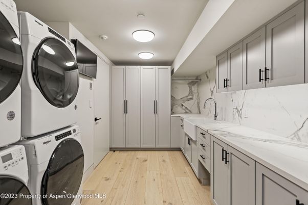 Interior, Marble Walls, Utility Closets, Washer, Wood Texture Flooring