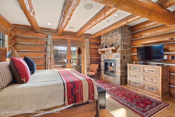 Bedroom, Fireplace, Interior, Recessed Lighting, Stone Walls, Wooden Beams, Wood Texture Flooring, Wooden Walls