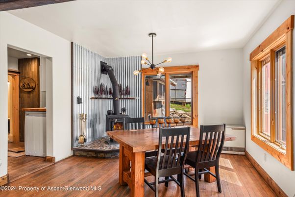 Dining room, Fireplace, Interior, Pendant Lights, Wood Texture Flooring