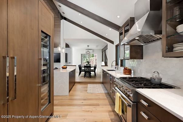 Dining room, Interior, Kitchen, Pendant Lights, Recessed Lighting, Stainless Steel Appliances, Wood Texture Flooring