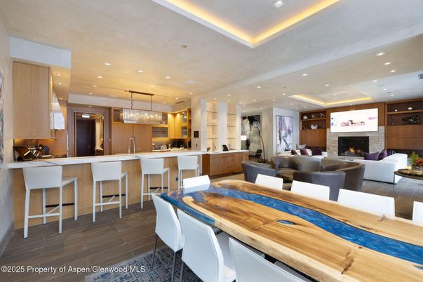 Chandelier, Dining room, Fireplace, Interior, Kitchen, Living room, Pendant Lights, Recessed Lighting, Wood Texture Flooring