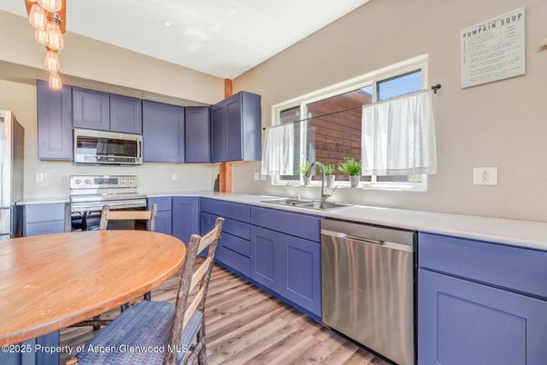 Dining room, Interior, Kitchen, Recessed Lighting, Stainless Steel Appliances, Wood Texture Flooring