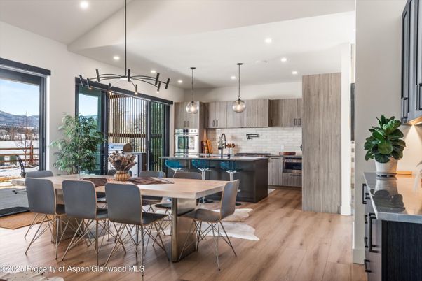 Dining room, Interior, Kitchen, Pendant Lights, Recessed Lighting, Stainless Steel Appliances, Wood Texture Flooring