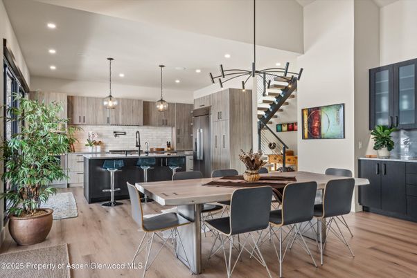 Dining room, Interior, Kitchen, Pendant Lights, Recessed Lighting, Stainless Steel Appliances, Wood Texture Flooring